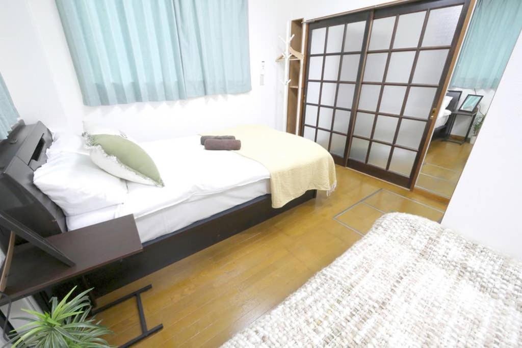 マスク配布ありa5 新宿10分 10人宿泊可能 出張在宅勤務に最適!!宿泊型テレワークスペース!!Wifi完備 回線安定してます!!長期宿泊受付中 Tokyo Eksteriør billede